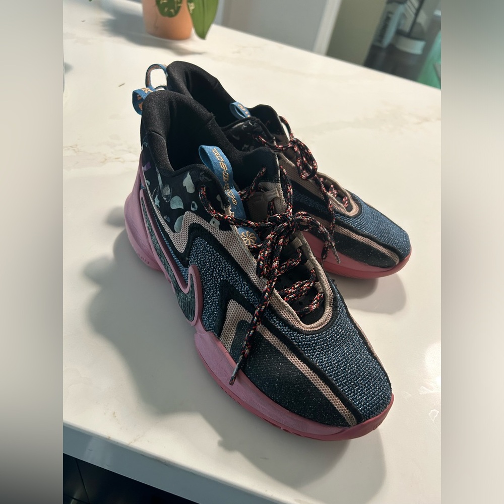 Nike Cosmic basketball athletic shoe. My teenager only wore these a few times.